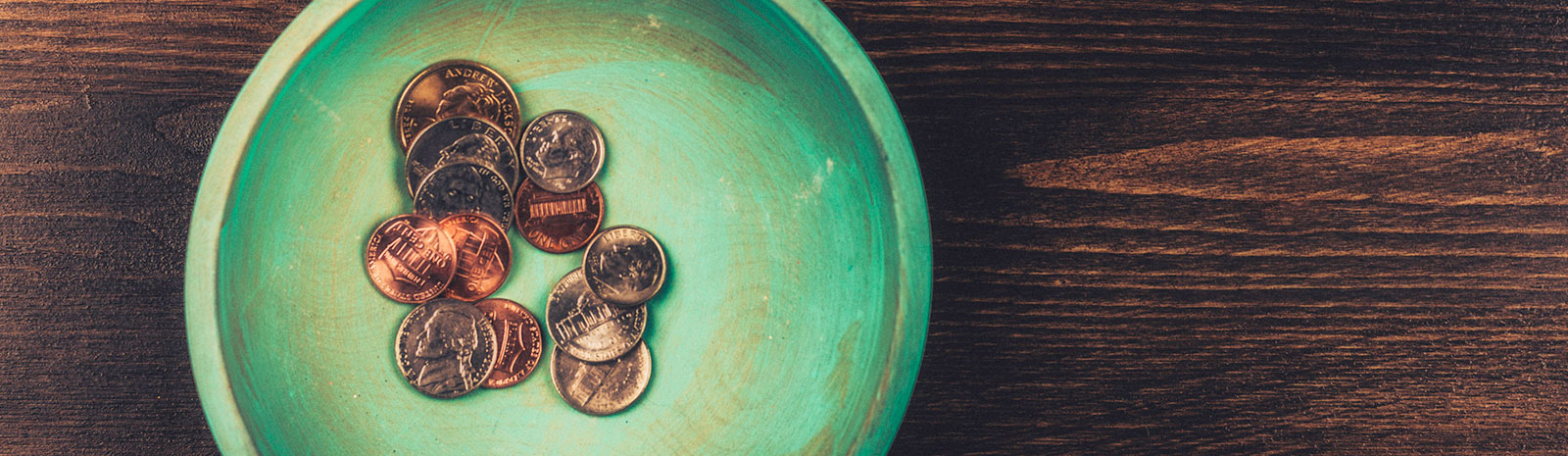 A handful of coins in a bowl