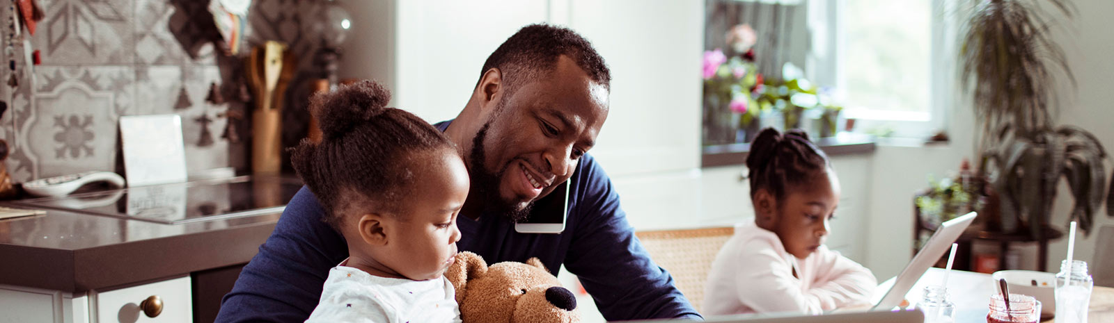 A dad with two young girls